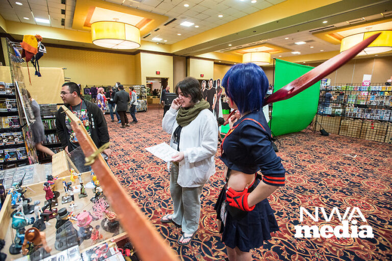 NWA Democrat-Gazette/ANTHONY REYES ¥ @NWATONYR
Sadie Gilliam of Harrison looks at a booth with Shai Percy of Mountain Home Friday, Nov. 13, 2015 during the Arkansas Anime Festival at the Holiday Inn in Springdale. Gilliam is dressed as Nagi Kengamine from the "Deadman Wonderland" series and Percy is dressed as Ry?ko Matoi from the Kill la Kill series. Many attendees of the festival are participating in cosplay. The festival continues today (Saturday) and Sunday from starting at 10 a.m. both days. The event features vendors, live demonstrations and talks about subjects including gaming, costume construction among other topics.